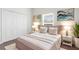 Bright bedroom featuring modern decor, a plush bed, and ample natural light from the window at 2267 Yalta Ter, North Port, FL 34286