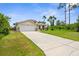 Well-maintained single-Gathering home with an expansive driveway and attached two-car garage at 2267 Yalta Ter, North Port, FL 34286