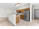 Functional kitchen with a breakfast bar, stainless steel refrigerator, and access to multiple rooms at 2267 Yalta Ter, North Port, FL 34286