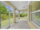 Enclosed patio with a ceiling fan at 2267 Yalta Ter, North Port, FL 34286