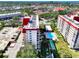 Aerial view of the condo building showing the pool, tennis court, and proximity to the beach at 232 Saint Augustine Ave # 505, Venice, FL 34285