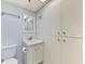 Cozy bathroom includes a white vanity with ample storage and a neutral wall color at 232 Saint Augustine Ave # 505, Venice, FL 34285