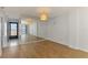 Bright living room with hardwood floors and a full mirrored wall to add extra space at 232 Saint Augustine Ave # 505, Venice, FL 34285