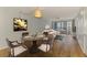 Open living room featuring a dining table and access to a balcony with city views at 232 Saint Augustine Ave # 505, Venice, FL 34285
