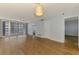 Open floor plan with wood floors and sliding glass doors leading to a balcony at 232 Saint Augustine Ave # 505, Venice, FL 34285