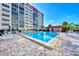 Beautiful pool with lounge seating for the community by the condo building at 232 Saint Augustine Ave # 505, Venice, FL 34285