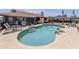 Lovely pool is surrounded by mature landscaping with lounge chairs for relaxing and enjoying the outdoors at 2331 Mission Valley Blvd, Nokomis, FL 34275
