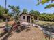 Private backyard with a fenced-in area, patio, and lush greenery perfect for outdoor relaxation and entertainment at 2331 Mission Valley Blvd, Nokomis, FL 34275