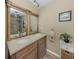 Bathroom featuring double vanity sinks and a shower/bath with light neutral walls at 2331 Mission Valley Blvd, Nokomis, FL 34275