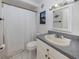 Bright bathroom with a vanity, decorative mirror, and shower-tub combination providing a functional space at 2331 Mission Valley Blvd, Nokomis, FL 34275