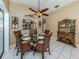 Cozy dining room featuring a glass table with seating for six and stylish decor at 2331 Mission Valley Blvd, Nokomis, FL 34275