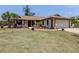 Charming single-story home featuring a 2-car garage, manicured lawn, and inviting front entrance at 2331 Mission Valley Blvd, Nokomis, FL 34275