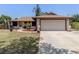 Inviting single-story home featuring a spacious 2-car garage and well-kept landscaping at 2331 Mission Valley Blvd, Nokomis, FL 34275