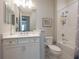 Well-lit bathroom with a vanity, tub, and shower combination showcases a clean and functional design at 249 Tracino Ter, Nokomis, FL 34275