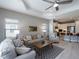 Spacious living room seamlessly connects to a modern kitchen, promoting a cohesive and open living experience at 249 Tracino Ter, Nokomis, FL 34275