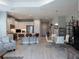 Open concept living space with kitchen, dining area, and comfortable seating, perfect for modern living at 249 Tracino Ter, Nokomis, FL 34275
