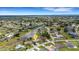 Aerial view of a neighborhood with a canal running through it, showcasing the home's location at 25509 Arequipa Dr, Punta Gorda, FL 33983