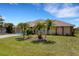 Charming single-story home with a well-manicured lawn, mature landscaping, and inviting curb appeal at 25509 Arequipa Dr, Punta Gorda, FL 33983