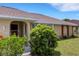 Charming home exterior with a well-maintained lawn, beautiful landscaping, and inviting curb appeal at 25509 Arequipa Dr, Punta Gorda, FL 33983