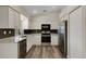 A modern kitchen with stainless steel appliances, granite countertops, and lots of cabinet space at 25509 Arequipa Dr, Punta Gorda, FL 33983