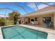 Sparkling pool with covered lanai, offering a serene backyard oasis for leisure and enjoyment at 25509 Arequipa Dr, Punta Gorda, FL 33983