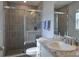 Modern bathroom featuring a tiled shower with glass doors, a vanity with a marble countertop, and neutral colors at 3003 58Th E Way, Palmetto, FL 34221
