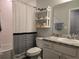 Bathroom featuring tub with curtain, shelf and vanity at 3003 58Th E Way, Palmetto, FL 34221