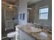 Bathroom featuring tiled shower with glass doors and marble countertop at 3003 58Th E Way, Palmetto, FL 34221
