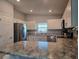 Modern kitchen with stainless steel appliances, ample countertop space, and white cabinets at 3003 58Th E Way, Palmetto, FL 34221