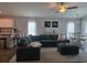 Relaxing living area featuring a comfortable sectional sofa, stylish rug, and adjacent dining space at 3003 58Th E Way, Palmetto, FL 34221