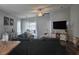 Open concept living area with dining space, teal sectional, and modern furnishings at 3003 58Th E Way, Palmetto, FL 34221