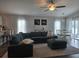 Open-concept living room showcasing a spacious layout with a comfortable sectional and casual dining area at 3003 58Th E Way, Palmetto, FL 34221
