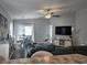 Bright living space with a dining area, modern lighting, and comfortable teal sectional at 3003 58Th E Way, Palmetto, FL 34221