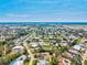 Breathtaking aerial view of a neighborhood featuring well-maintained homes and lush greenery, offering a peaceful and inviting atmosphere at 301 Gulf Dr, Venice, FL 34285