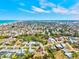 Expansive aerial view showcases a coastal community with homes, green spaces, and easy access to the beautiful beach at 301 Gulf Dr, Venice, FL 34285