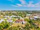Expansive aerial view of a charming home in a lush, green neighborhood close to the open water and scenic waterfront at 301 Gulf Dr, Venice, FL 34285