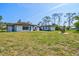 Expansive backyard includes a patio, shed, and plenty of space for outdoor activities at 301 Gulf Dr, Venice, FL 34285