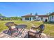 Patio seating with view of the backyard, home, and shed at 301 Gulf Dr, Venice, FL 34285