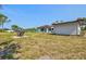 View of a large backyard with seating area near the home at 301 Gulf Dr, Venice, FL 34285