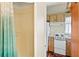 Shower/tub combination adjacent to well equipped kitchen for in-law suite at 301 Gulf Dr, Venice, FL 34285
