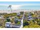 Elevated boardwalk through lush greenery leading to a sandy beach and shimmering ocean, perfect for nature enthusiasts at 301 Gulf Dr, Venice, FL 34285
