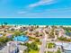 Aerial perspective features a home near beachfront, accentuating waterfront living and new construction in the neighborhood at 301 Gulf Dr, Venice, FL 34285