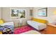 Bright bedroom boasts ample natural light and comfortable, stylish furnishings at 301 Gulf Dr, Venice, FL 34285