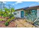 A charming home with a tile roof, well-maintained landscaping, and a welcoming walkway at 301 Gulf Dr, Venice, FL 34285