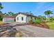 Exterior of a home and detached garage with mature landscaping at 301 Gulf Dr, Venice, FL 34285