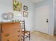 Inviting foyer with classic decor, terrazzo flooring, and a charming vintage desk at 301 Gulf Dr, Venice, FL 34285