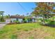 Inviting single-story home features lush landscaping and a welcoming facade at 301 Gulf Dr, Venice, FL 34285