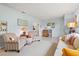 Inviting living room with pastel walls, vintage furniture, and ample natural light at 301 Gulf Dr, Venice, FL 34285