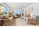 Bright living room with comfortable seating, large window, and stylish decor at 301 Gulf Dr, Venice, FL 34285