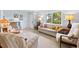 Bright living room with traditional furniture, a large window, and a cozy ambiance at 301 Gulf Dr, Venice, FL 34285